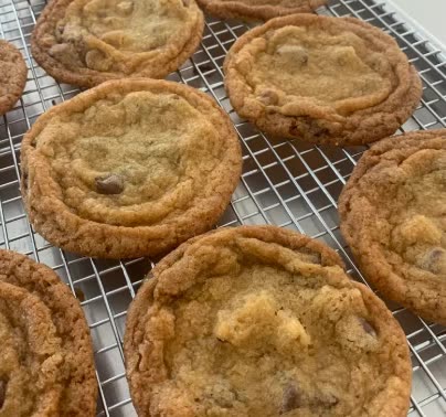 Chocolate chip cookies cooling on a rack